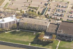 arial shot of a multi-story building and roofing